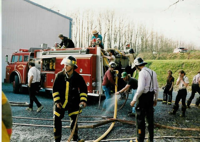 Cleaning up after the woods fire at the Dienner's... 4/15/94